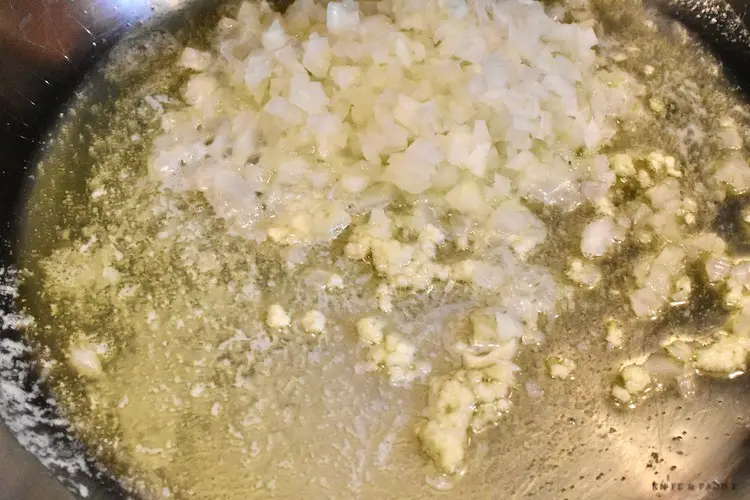Onions, butter and garlic sautéing in a pan