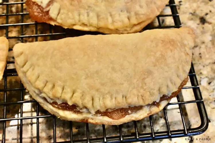 Hand pies cooling on a wire rack