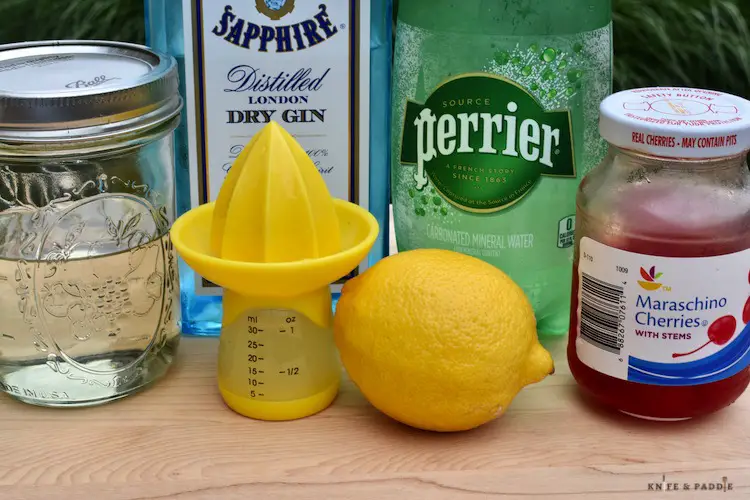 Simple sugar, gin, soda water, maraschino cherries, lemon, fresh squeezed lemon juice