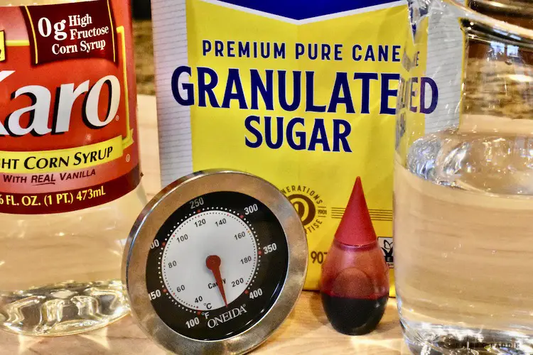 Light Karo syrup, sugar, water, red food coloring and candy thermometer