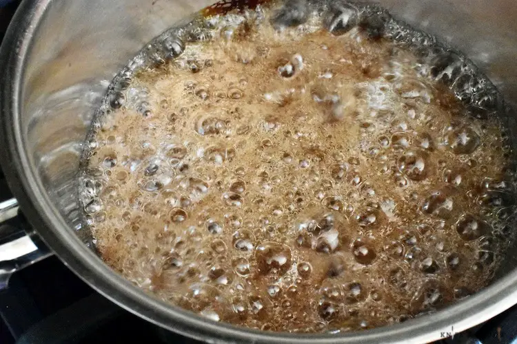 Sugar, cinnamon, water and light Karo syrup in a saucepan boiling