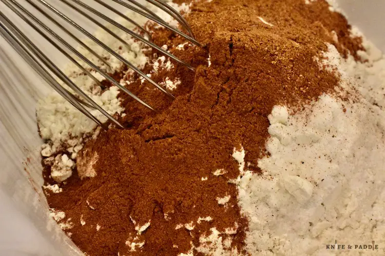 Flour, cinnamon, nutmeg, baking powder and salt in a mixing bowl
