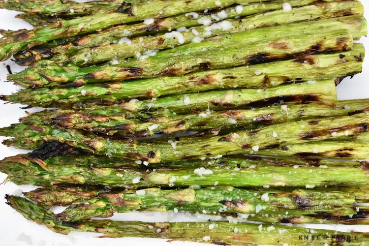 Grilled Asparagus with parmesan cheese on a plate
