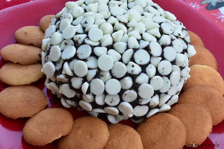 Oreo Cream Cheese Ball on a plate served with vanilla wafers