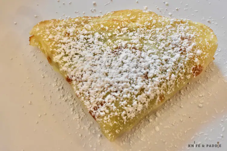 crepe stuffed with Nutella and topped with powdered sugar