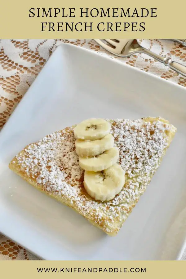 Simple Homemade French Crepes with Nutella filling and topped with bananas and powdered sugar
