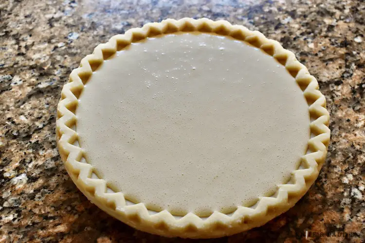 Filled, unbaked pie shell
