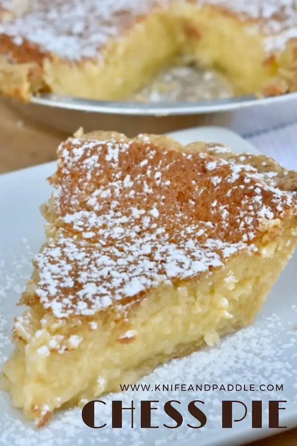 Slice of chess pie with powdered sugar on a plate