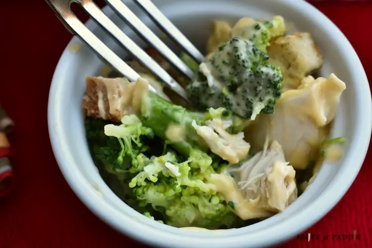 Broccoli, stuffing, chicken and creamy cheese sauce in a small bowl