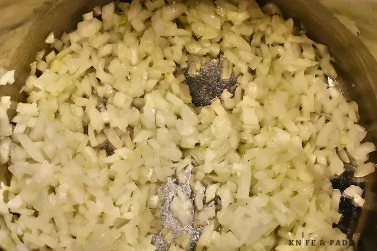 chopped onion in a sauce pan