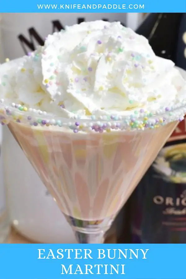Easter Bunny Martini topped with whipped cream rimmed with marshmallow topping and pastel nonpareils