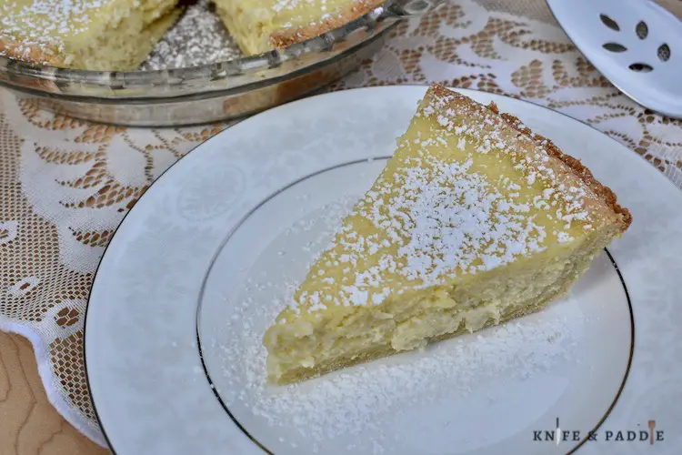 Slice of Italian Easter Pie with powdered sugar on the top