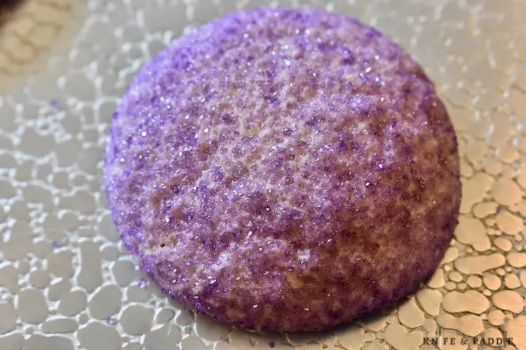 Purple cookie on a baking sheet out of the oven