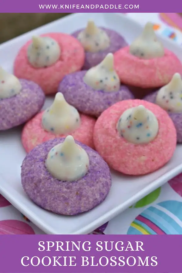 Purple and pink sugar cookies with Birthday Hershey's Kisses on the top