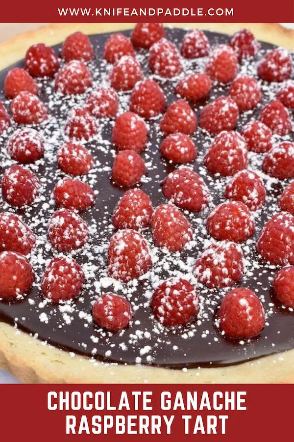 Chocolate Ganache Raspberry Tart with powdered sugar