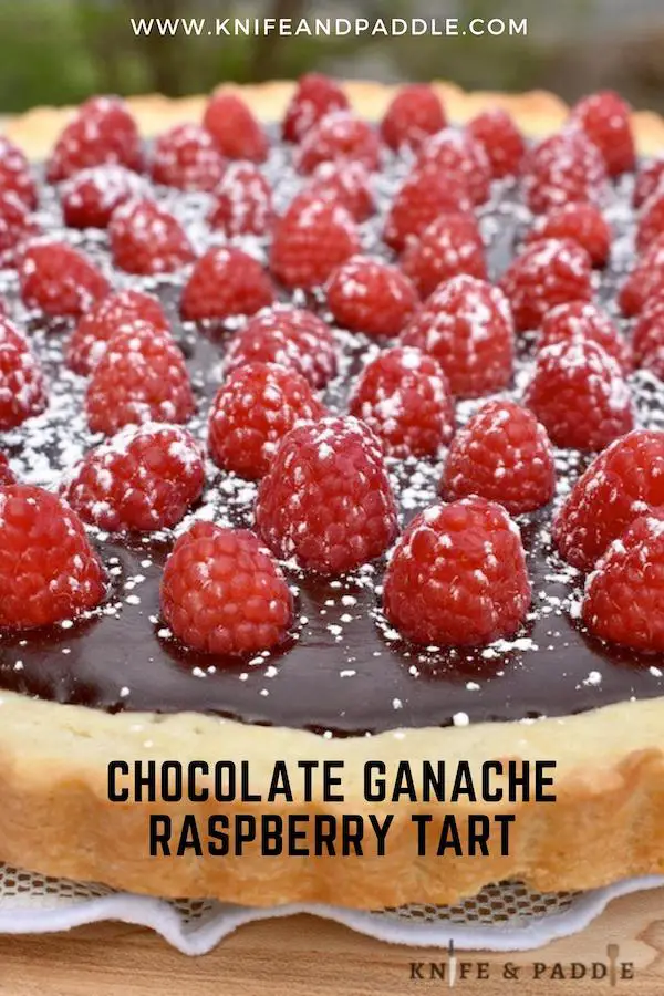 Chocolate Ganache Raspberry Tart with powdered sugar