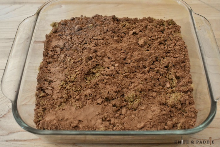 Flour, sugar, baking powder, salt, cocoa powder, vegetable oil, pure vanilla extract and milk mixed together and spread evenly in a 8x8 inch baking dish.  Topped with brown sugar, and more cocoa powder.  