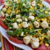 Sliced Tomatoes with Arugula and Corn