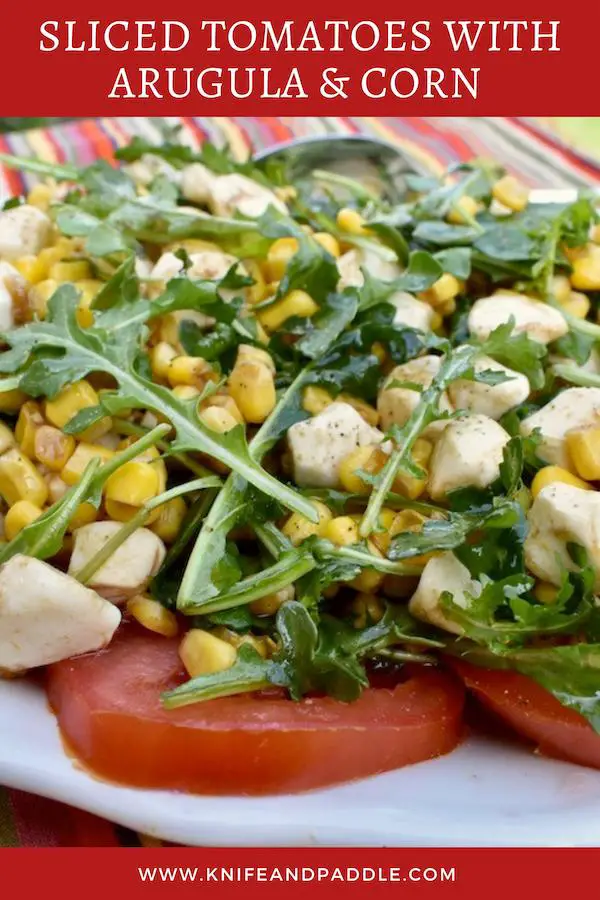 Tomato slices, topped with arugula, corn and mozzarella balls tossed in an olive oil and balsamic dressing