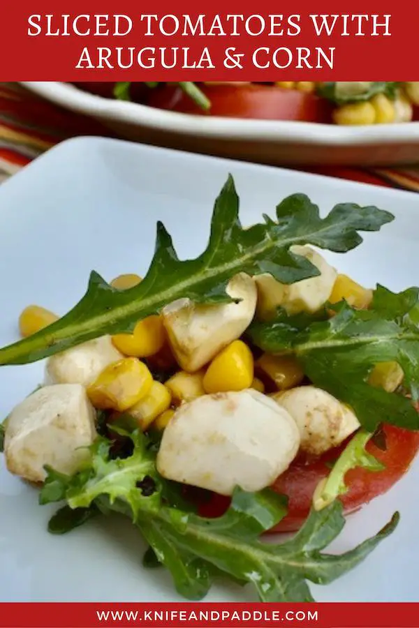 Tomato slice, topped with arugula, corn and mozzarella balls tossed in an olive oil and balsamic dressing