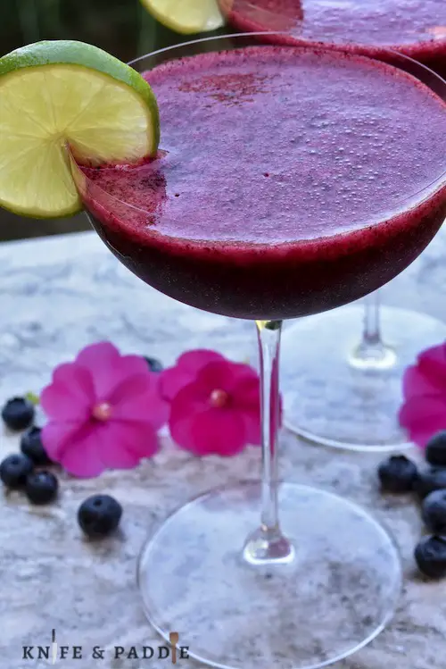 Frozen Blueberry Daiquiri with a lime slice