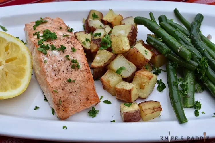Lemon, fish, red roasted potatoes and green beans with shallot and lemon