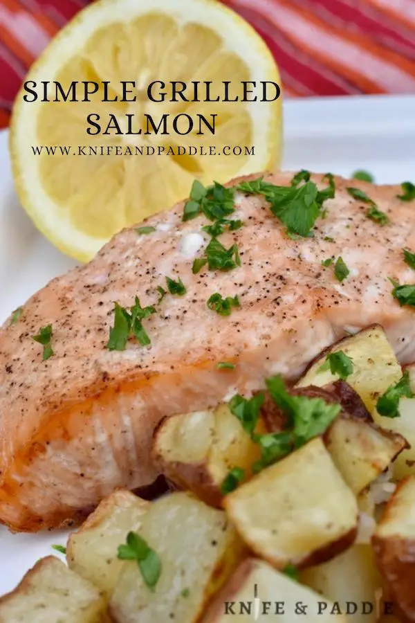 Simple Grilled Salmon with lemon wedge and red roasted potatoes