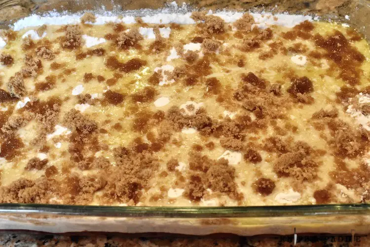 pie filling with extracts, white cake mix, melted butter and brown sugar in a 9x13 inch baking dish