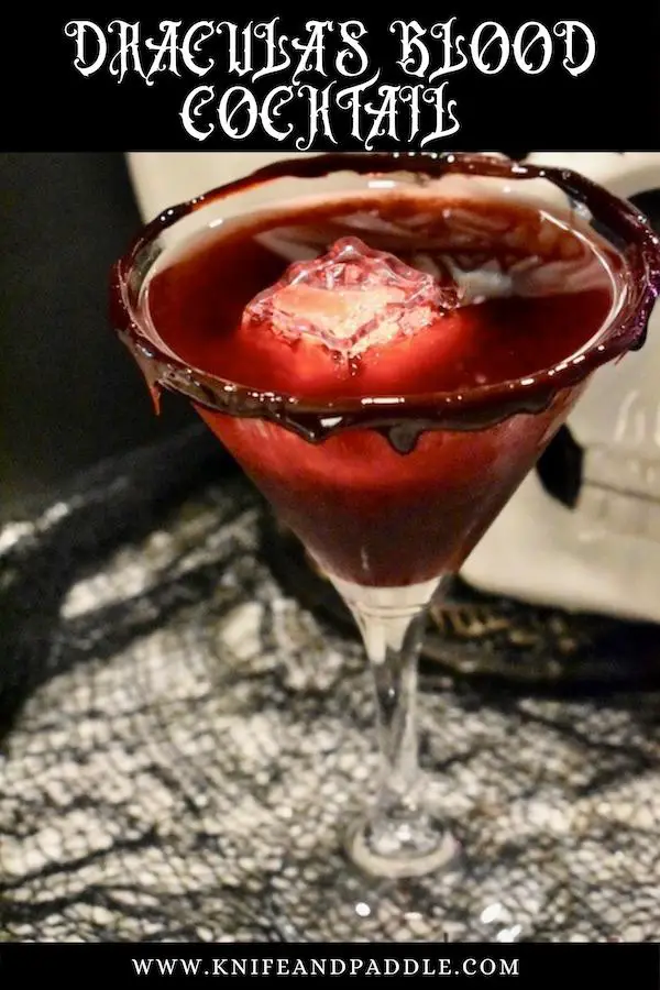 White rum, peach schnapps, black cherry juice strained in a blood dripped martini glass with a red LED ice cube