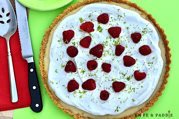 Graham Cracker Crust, filling and whipped cream topping with fresh raspberries