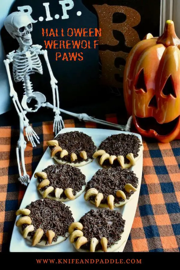Spooky round sugar cookies, chocolate butter cream frosting and whole cashews for claws 