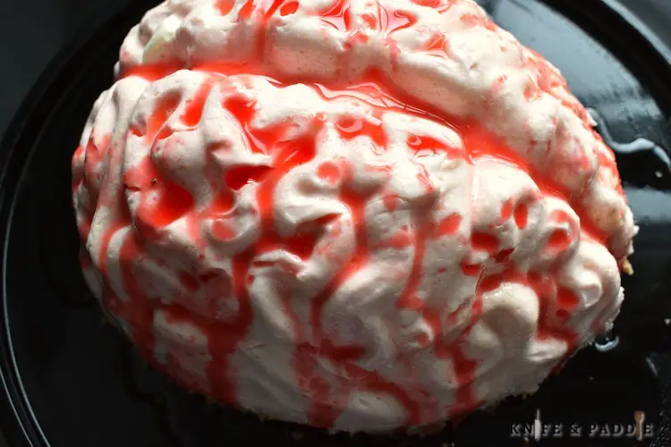 No-Bake Cheesecake Brain with strawberry sauce
