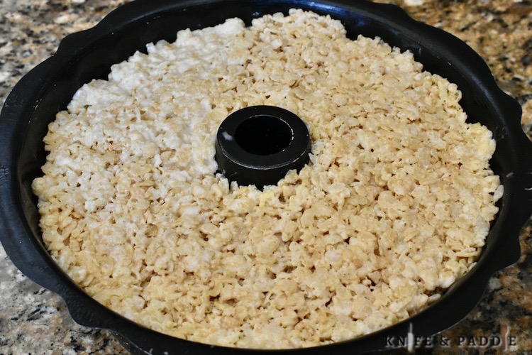 Rice cereal, butter, and marshmallows pressed into a round pan
