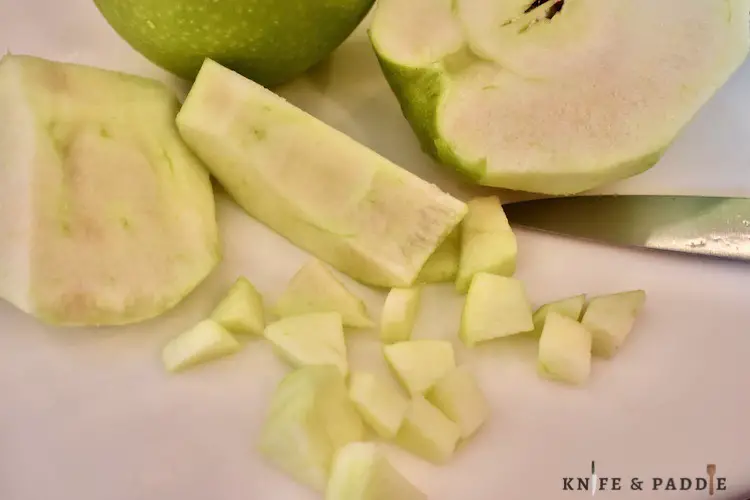 Granny Smith's peeled and cubed on a cutting board