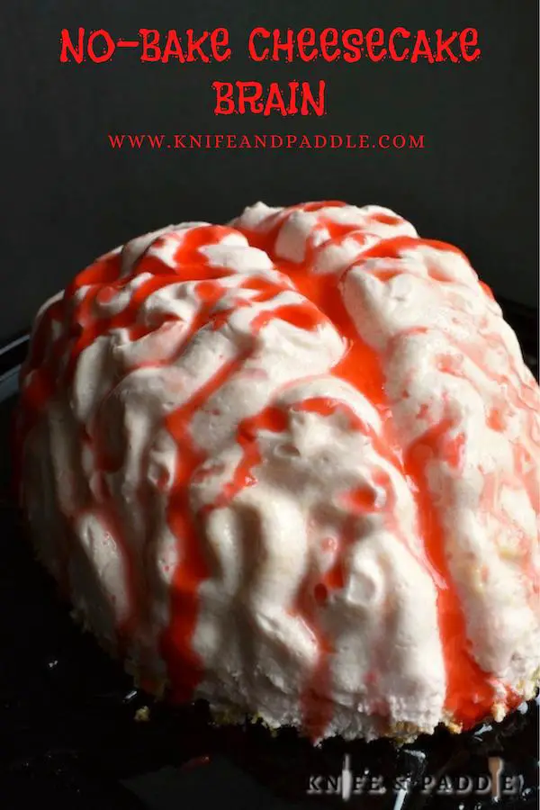 No-Bake Cheesecake Brain covered in strawberry sauce