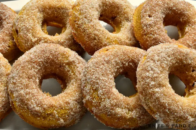 Baked Pumpkin Donuts with cinnamon-sugar topping on a plate