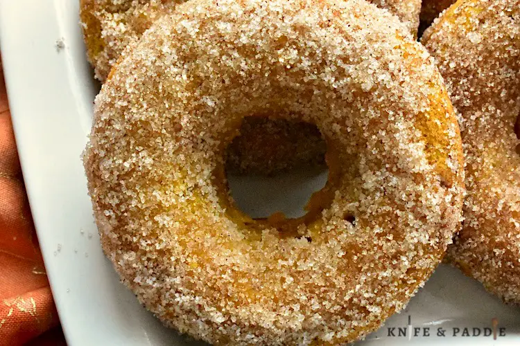Baked Pumpkin Donuts with cinnamon-sugar topping on a plate
