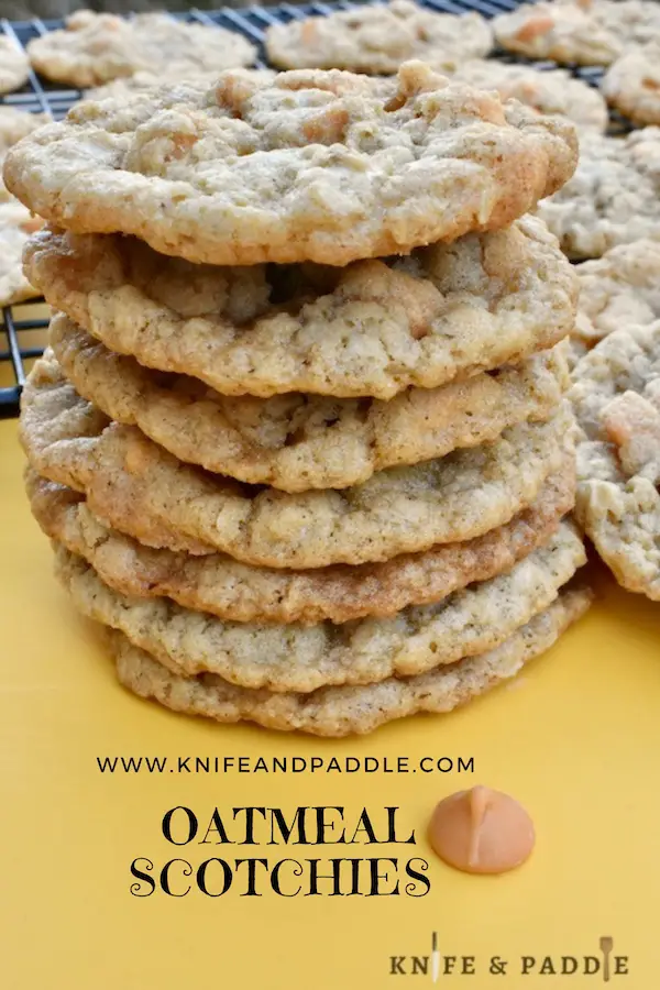 Oatmeal Scotchies stacked and on a wire rack 