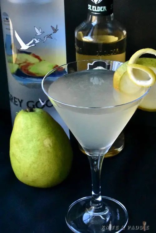 Grey Goose Vodka, Elderflower Liqueur, lemon juice and simple syrup poured into a cocktail glass garnished with a pear slice and lemon twist