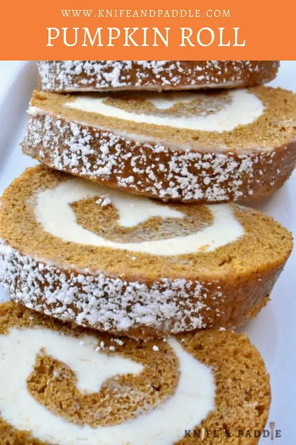 Slices of Pumpkin Roll with cream cheese filling on a plate