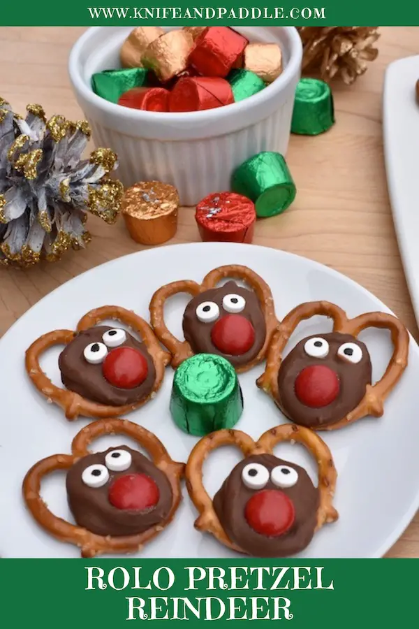 Red M&Ms for the nose, candy eyeballs for the eyes and caramel and chocolate melted to create a cute Christmas treat