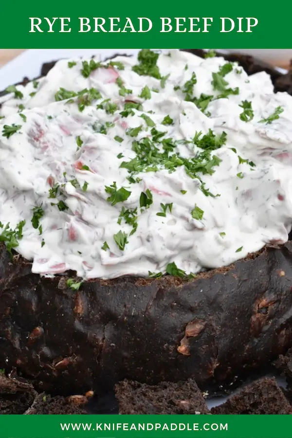 sour cream, mayonnaise, onion, parsley, dill weed and dried beef mixed together and poured into a hallowed out loaf