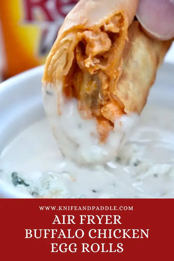 Air Fryer Buffalo Chicken Egg Roll dipped into blue cheese dressing 
