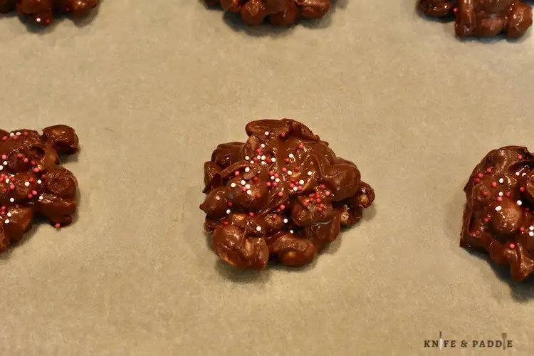 Nut cluster candy on parchment paper