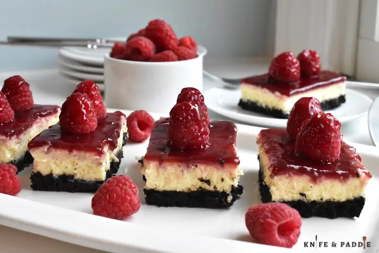Raspberry Cheesecake Bars on plates