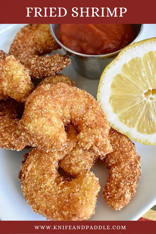 Fried Shrimp plate with a lemon wedge and cocktail sauce