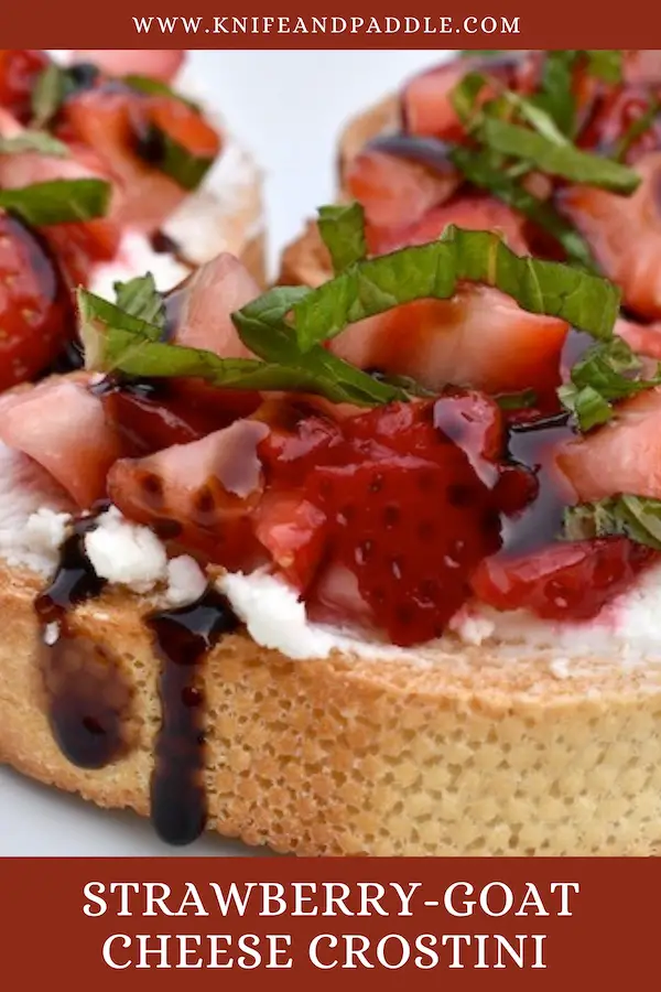 Strawberry-Goat Cheese Crostini on a plate topped with fresh mint and balsamic glaze