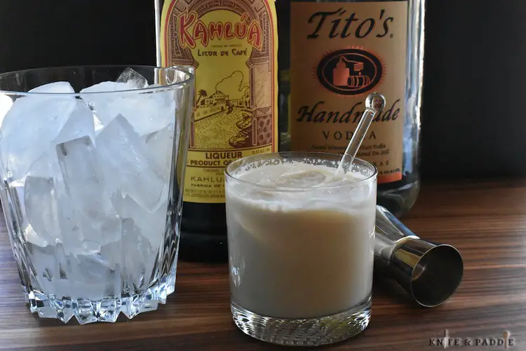 Ice bucket, Kahlúa and vodka mixed with heavy cream served in a lowball glass