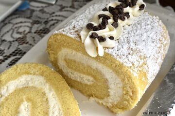 Cannoli Cake Roll with cannoli topping and mini chocolate chips