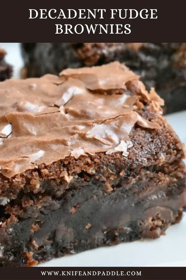 Decadent Fudge Brownies cut into a squares on a plate